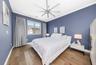 Primary bedroom with custom electronic window coverings