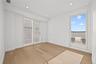 Empty room with light wood-type flooring and recessed lighting