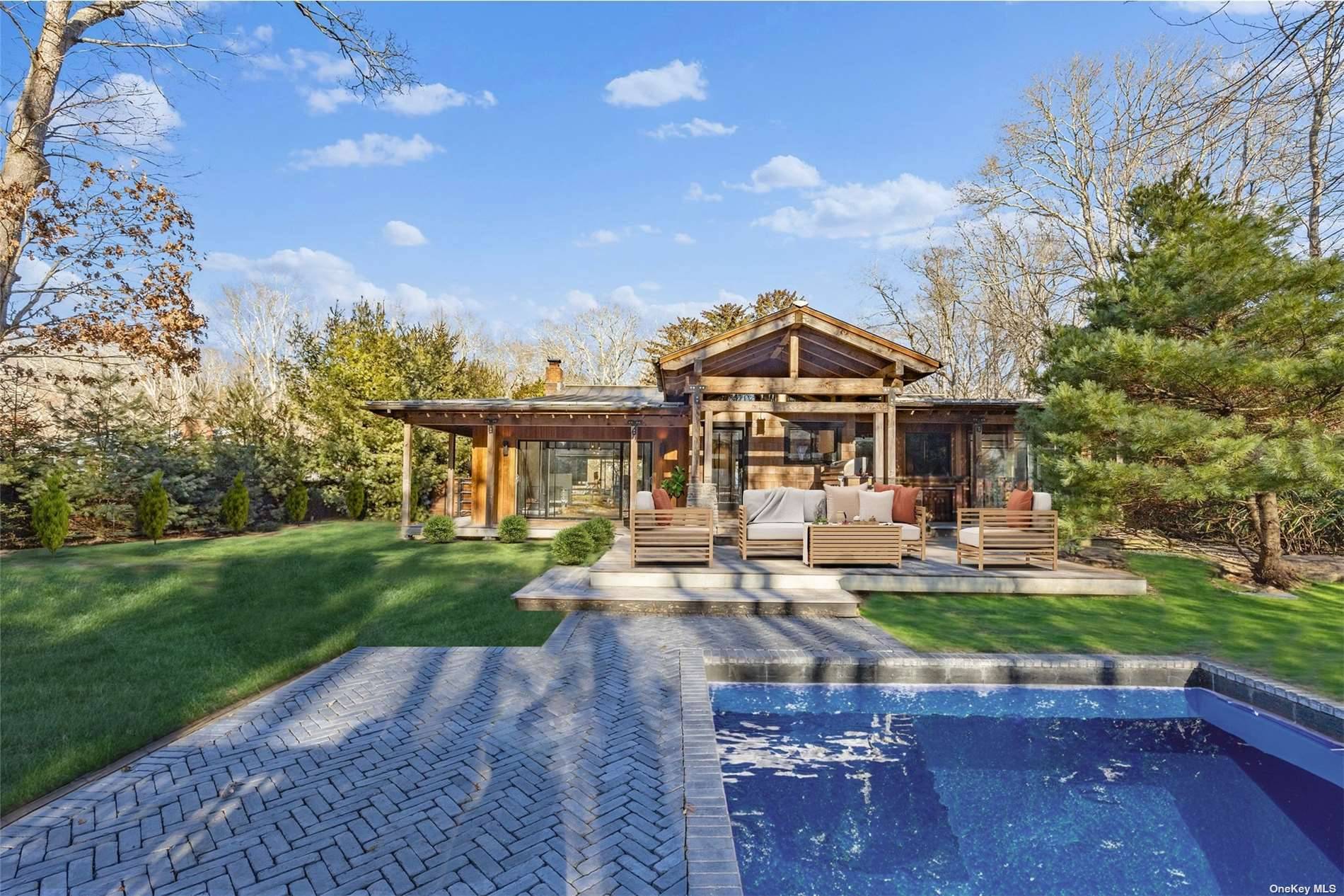 Sunset facing, Nestled at the end of a serene, long driveway on an expansive nearly 3 4 acre plot, this enchanting Southampton home invites you into a world of tranquil ...