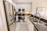 Bright, functional kitchen with open flow for entertaining.