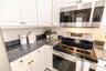 Bright, functional kitchen with open flow for entertaining.