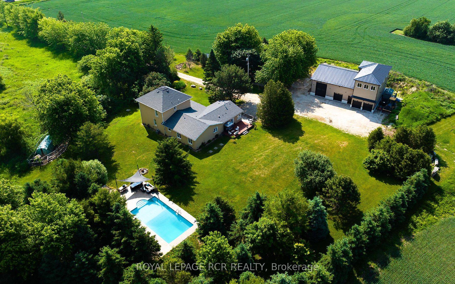 Drive down the long secluded driveway to this 14acre private well set back 3200 sq ft home with separate 3500 sq ft approx 2 level heated shop.