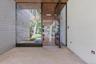 Hanover Porcelain Pavers lead to Floor to Ceiling Glass Door
