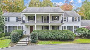 This grand Center Hall Colonial is situated at the end of a private, tree lined drive on a sprawling 3.