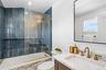 Full bath featuring vanity and shower / tub combination