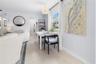 View of dining area and kitchen from Sun Room