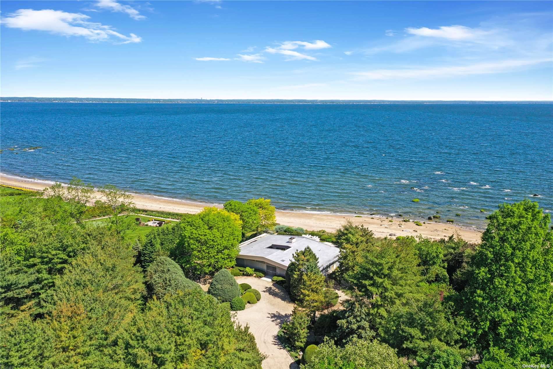 Serenity by the Sound. This beach house sits on over 2 acres, and is right on Long Island Sound.
