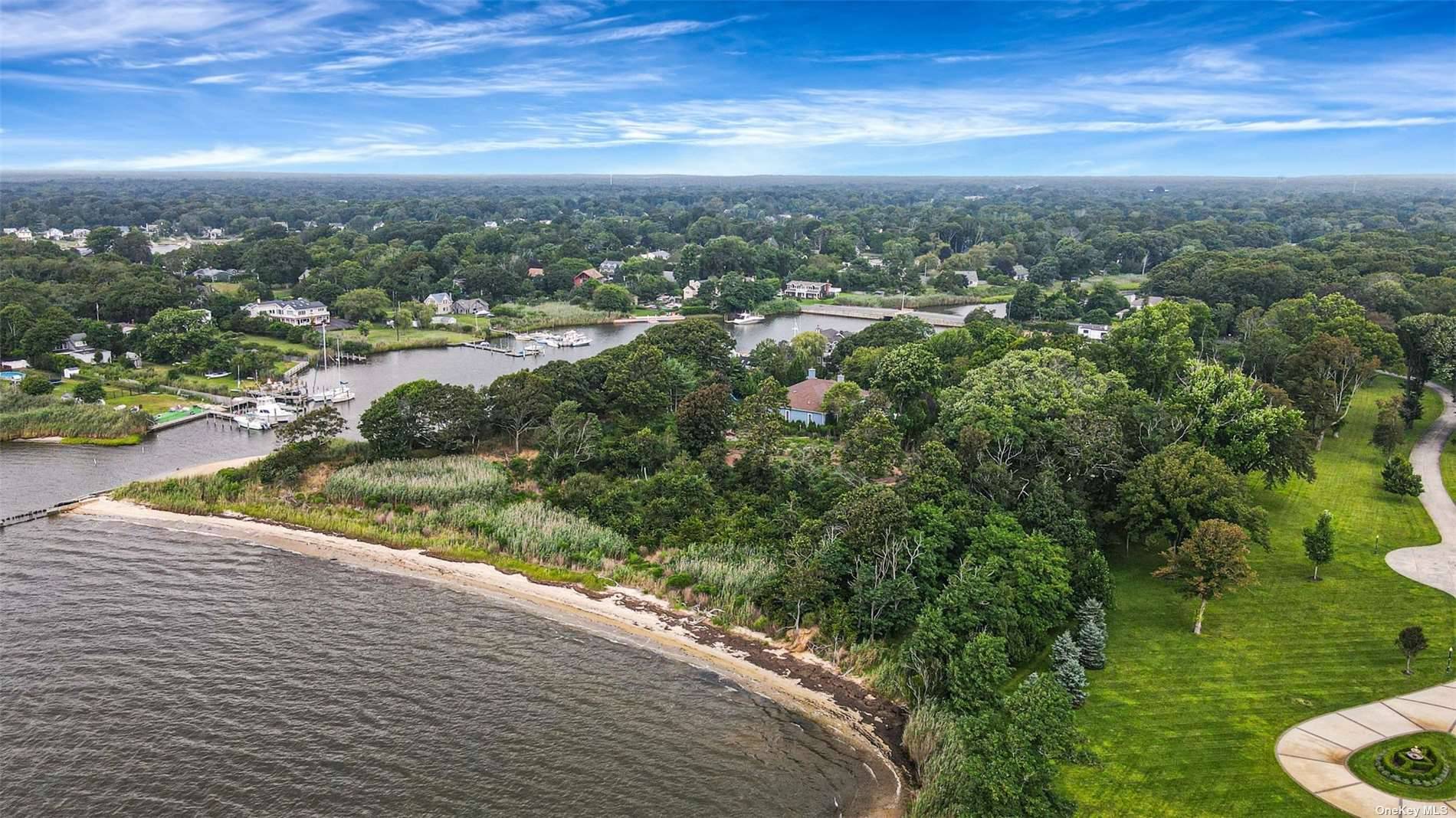 Exquisite Bayfront Haven with Over 200 Feet of Sandy Shoreline.