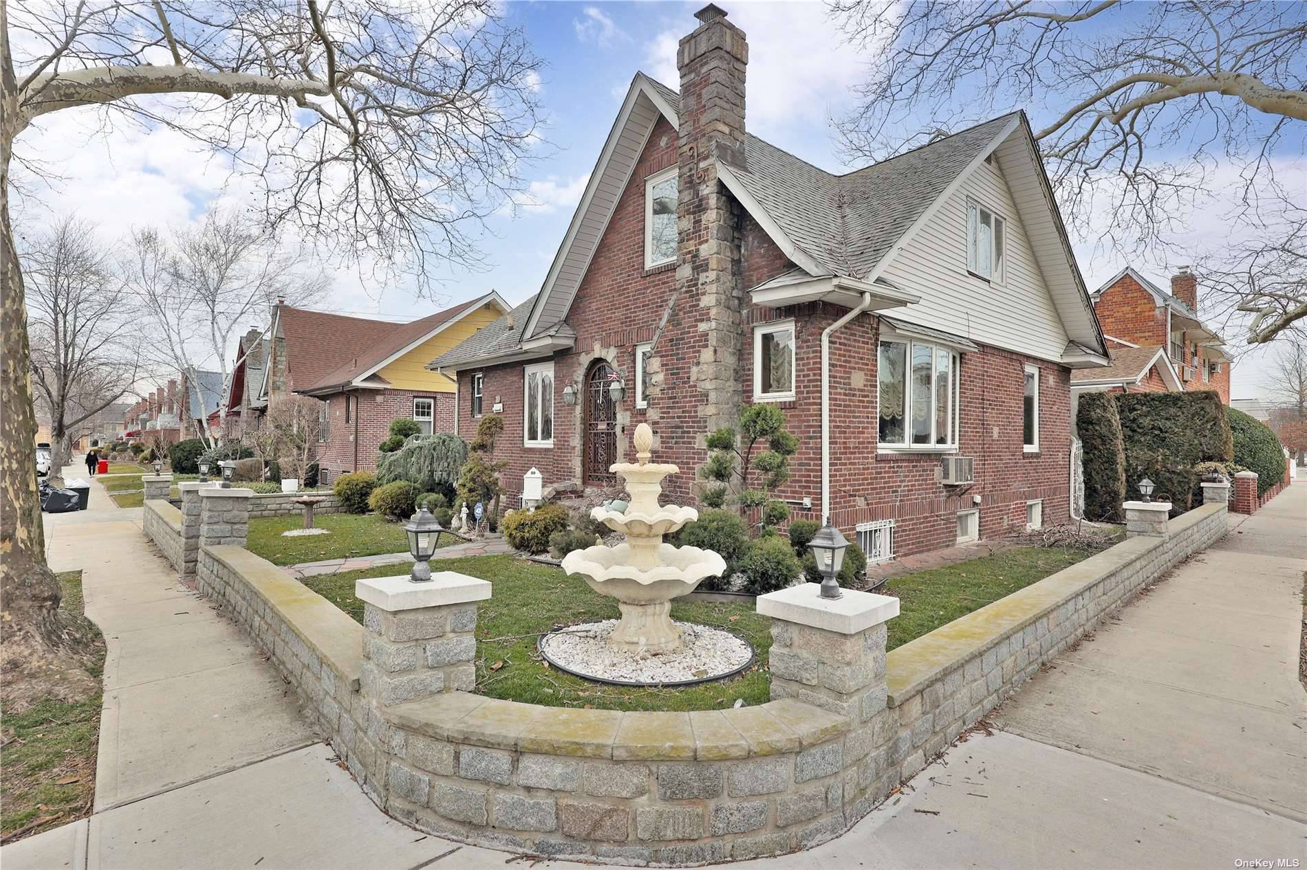 Fully detached, two family brick tudor located in the heart of Middle Village.