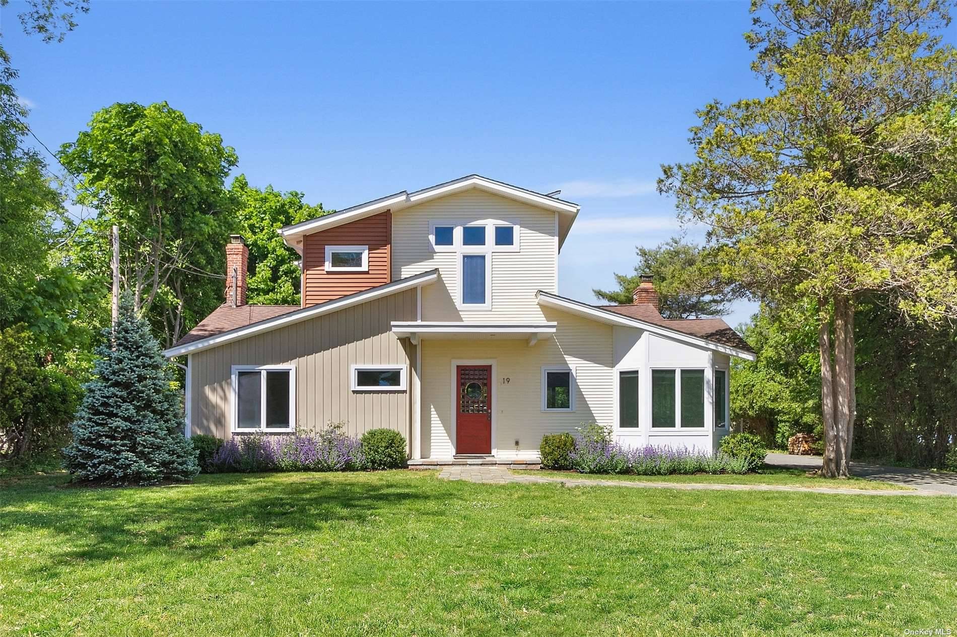 Conveniently located in East Quogue Village enjoy this beautifully renovated Post Modern home.