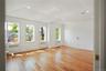 Spare room featuring light wood-type flooring, recessed lighting, and radiator