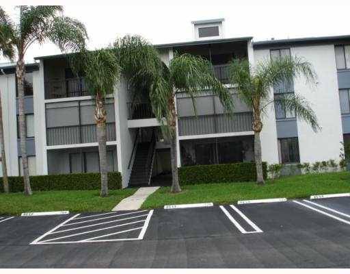 Watch The Beautiful Sunrise From This Third Floor Condo With Vaulted Ceilings, Screened Covered Patio, Manned Gated Community.