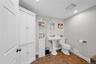 Bathroom featuring recessed lighting and dark tile patterned floors