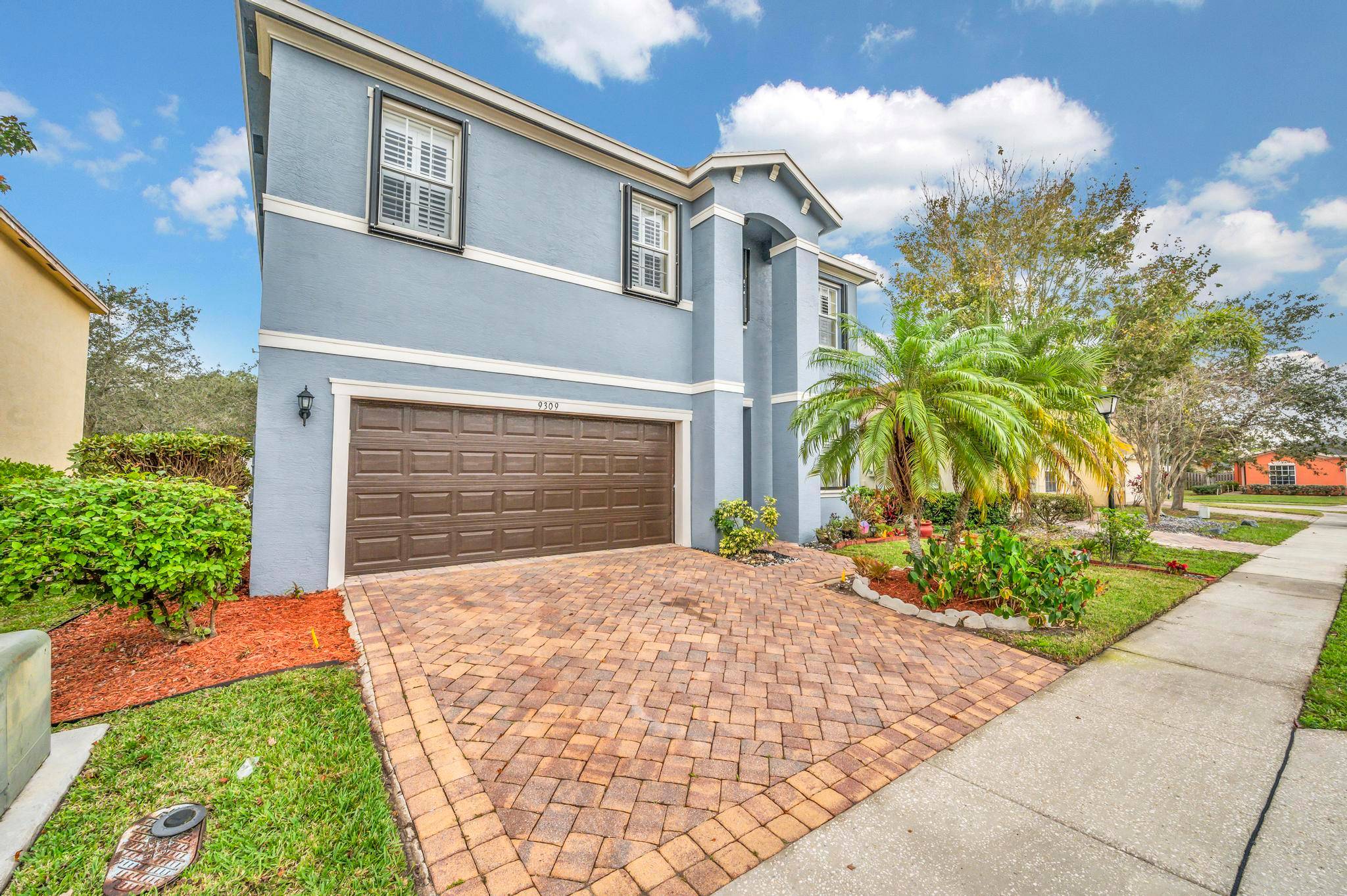 This beautiful two story Florida home features five bedrooms and three bathrooms, providing ample space for a comfortable living experience.