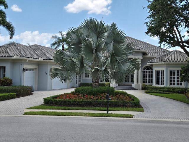 Enjoy the best of country club living in this beautiful sun filled estate home that offers stunning panoramic views of the 6th and 16th holes of the South course.