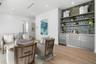 Second floor hosts a morning/evening bar and seating for a cozy conversation