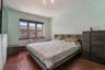 Bedroom featuring dark wood-style flooring and a wall unit AC
