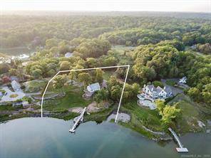 A magnificent property with a dock sits high above Scotts Cove with nearly 500 feet of direct waterfront.