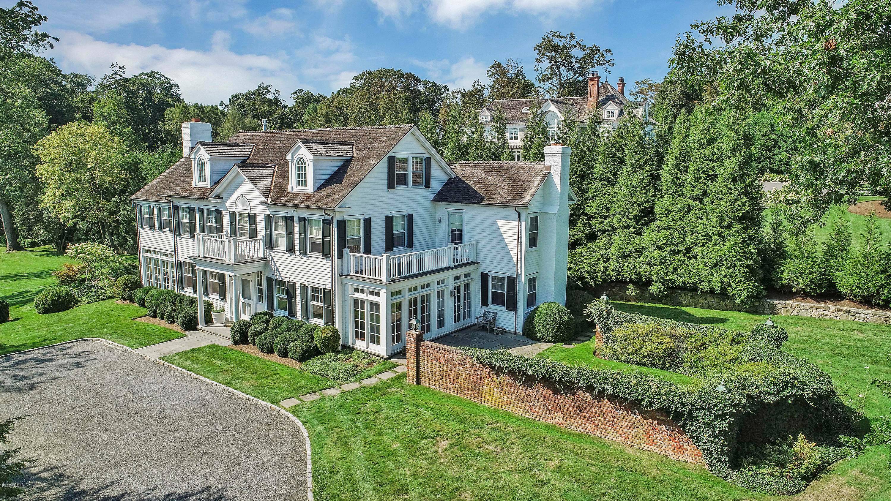Belle Haven Association Timeless five bedroom Colonial boasts a sundrenched interior that combines chic updates with classic architectural details on a verdant.