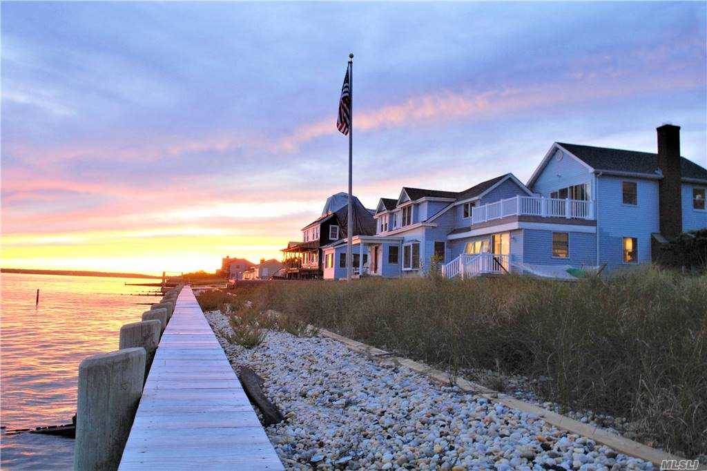 Spectacular Renovated Bayfront, embracing the prevailing southwesterly breezes amp ; sweeping views over the Peconic Bay to the South Fork.