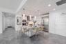 This show stopping modern kitchen is the centerpiece of the home, designed for both style and functionality. A sleek quartz island with storage and si