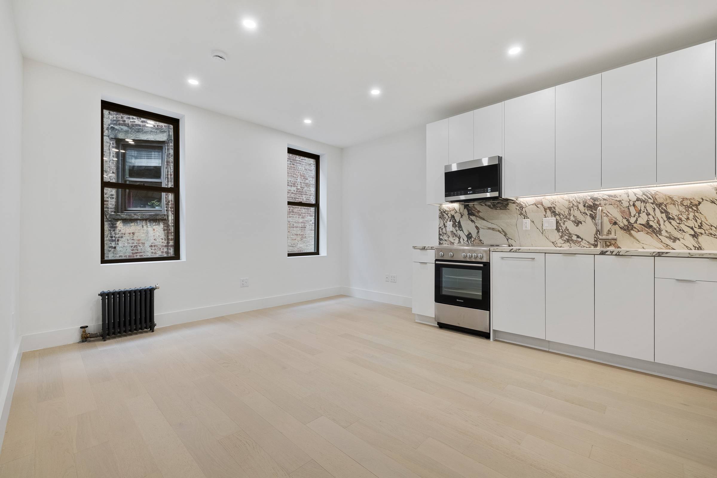 Beautifully gut renovated 1 bedroom, 1 bath residence featuring a stunning large kitchen with stainless steel appliances, wide plank Oak flooring, spacious bedrooms and in unit washer dryer.