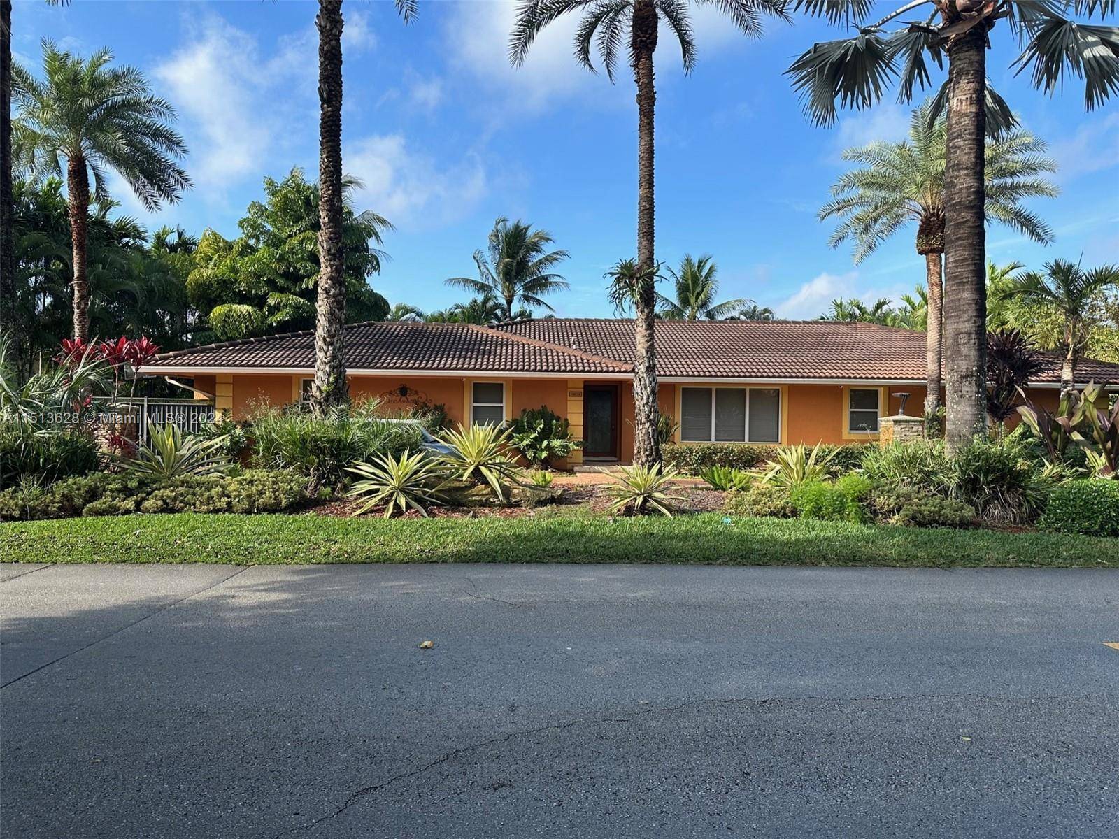 Beautiful and upgraded home with the lowest price in the desired Country Club of Miami, Large fenced patio, with a heated pool, and Tiki Hut, which is great for entertaining.
