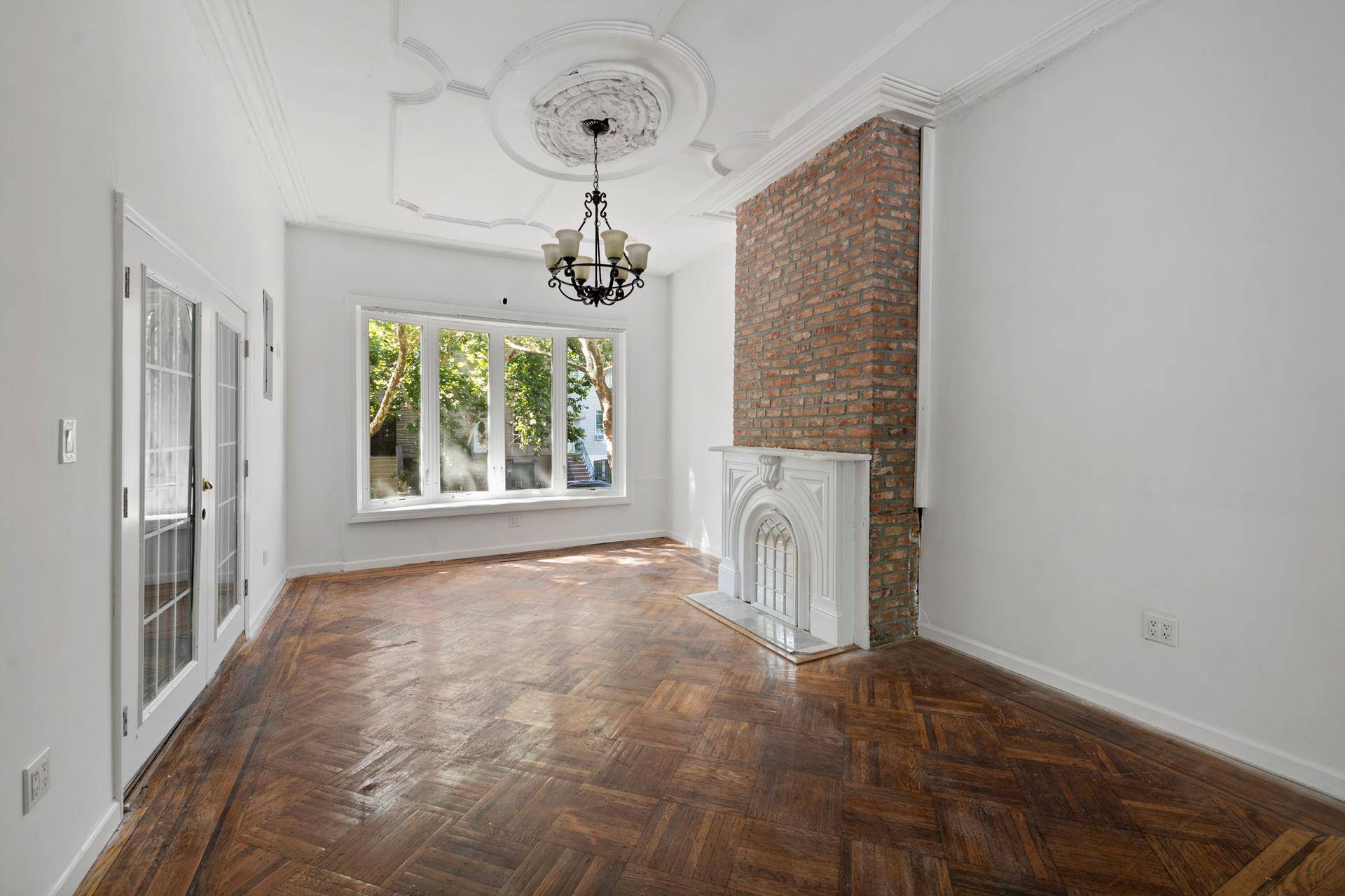 349 Monroe Street sits in the heart of a cheerful tree lined Bed Stuy block.