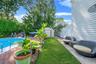 Fenced backyard with a patio and a storage shed