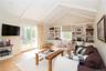 Family room with fireplace, doors to backyard and built-ins