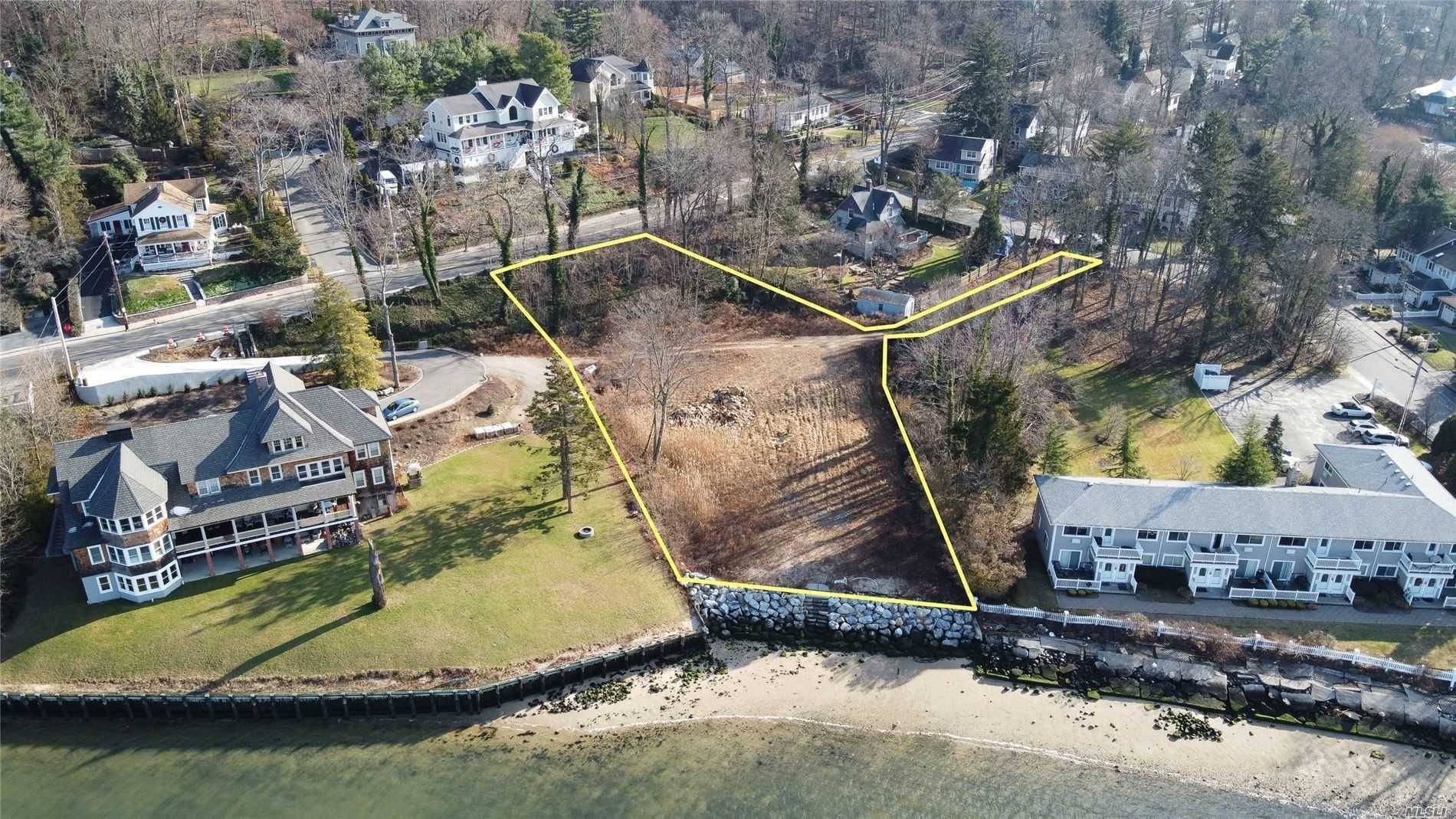 Waterfront opportunity to build your dream home in Northport Village on the harbor with unobstructed views.