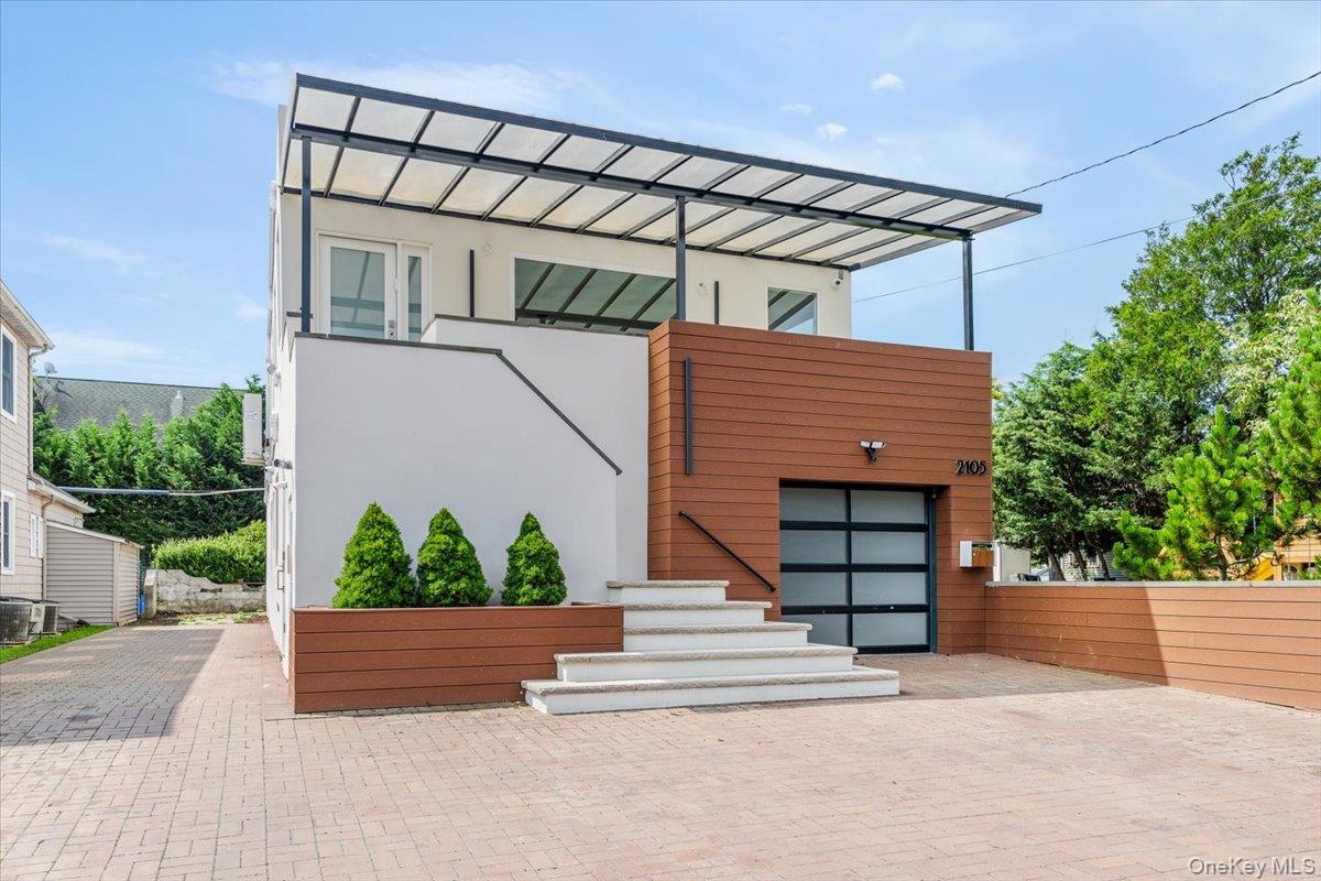 Contemporary house featuring stucco siding