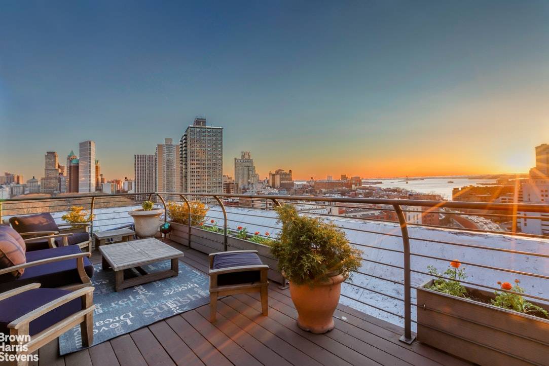 Enjoy every hour of the day and night in this gorgeous sprawling corner penthouse duplex with two huge private terraces and breathtaking open views of New York Harbor, the Statue ...
