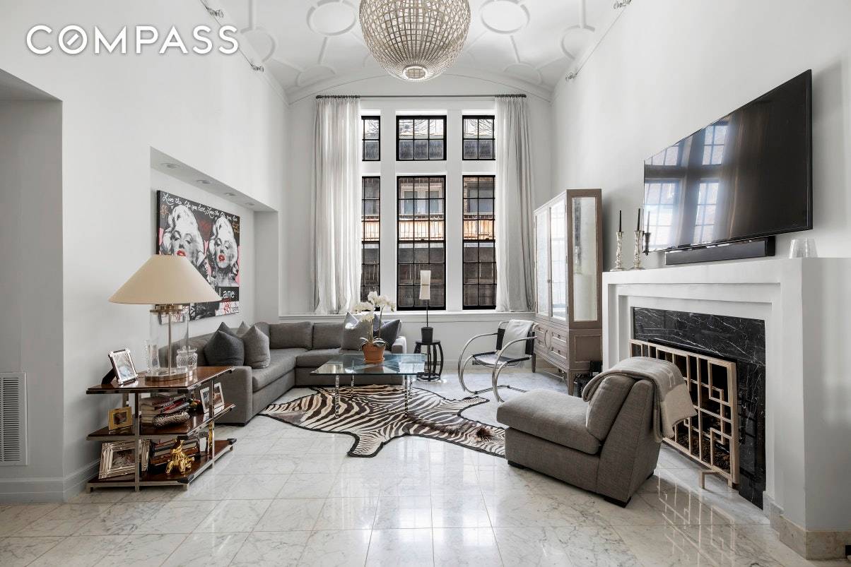 Beautifully renovated, this elegant and dramatic 2 bedroom, 2 full bathroom duplex boasts wonderful prewar detail, an impressive great room with 16 foot ceilings, and a coveted address in the ...