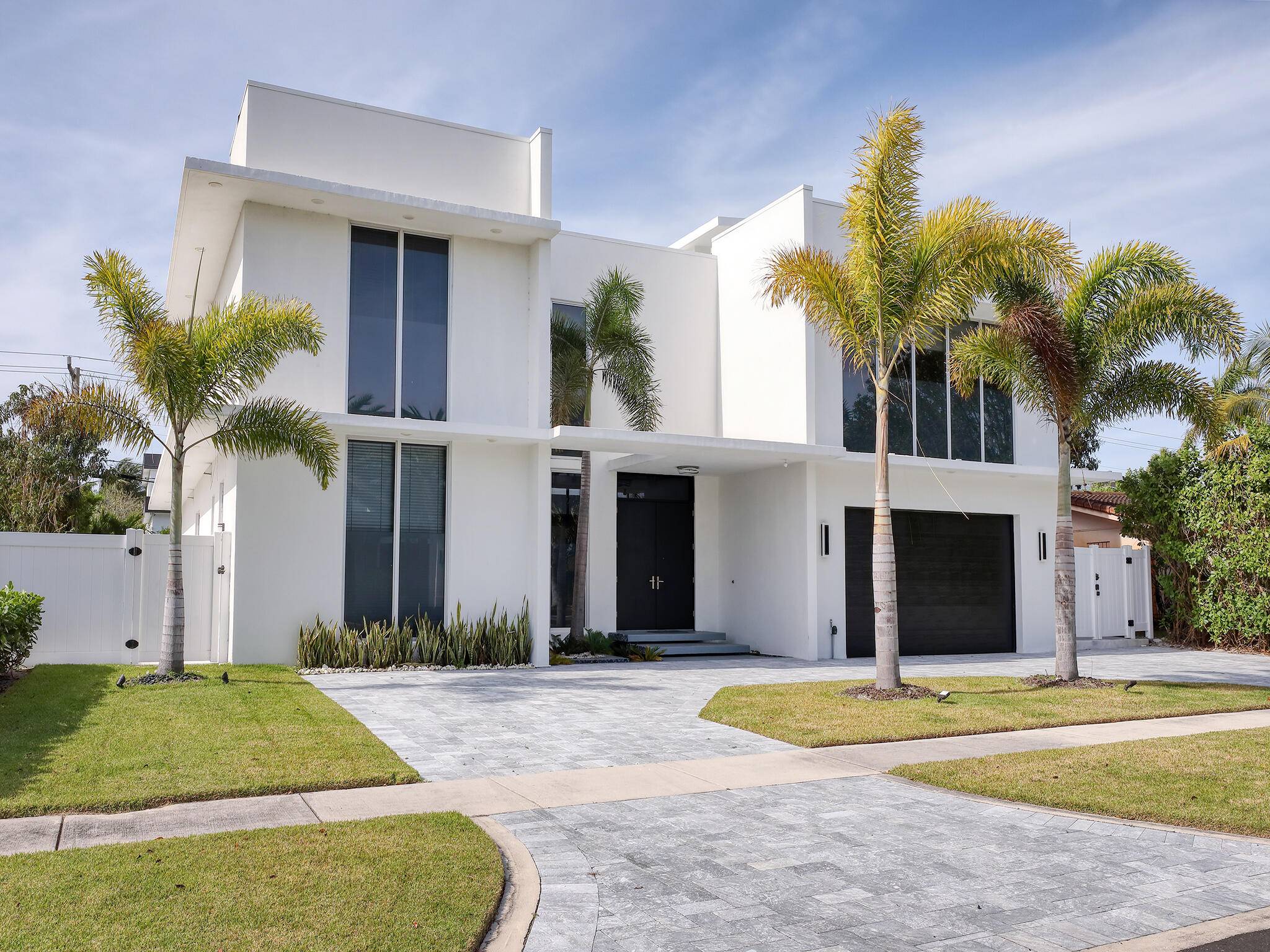 LOCATION IS EVERYTHING ! IN THE HEART OF EAST BOCA RATON, THIS BEAUTIFUL CONTEMPORARY ESTATE.