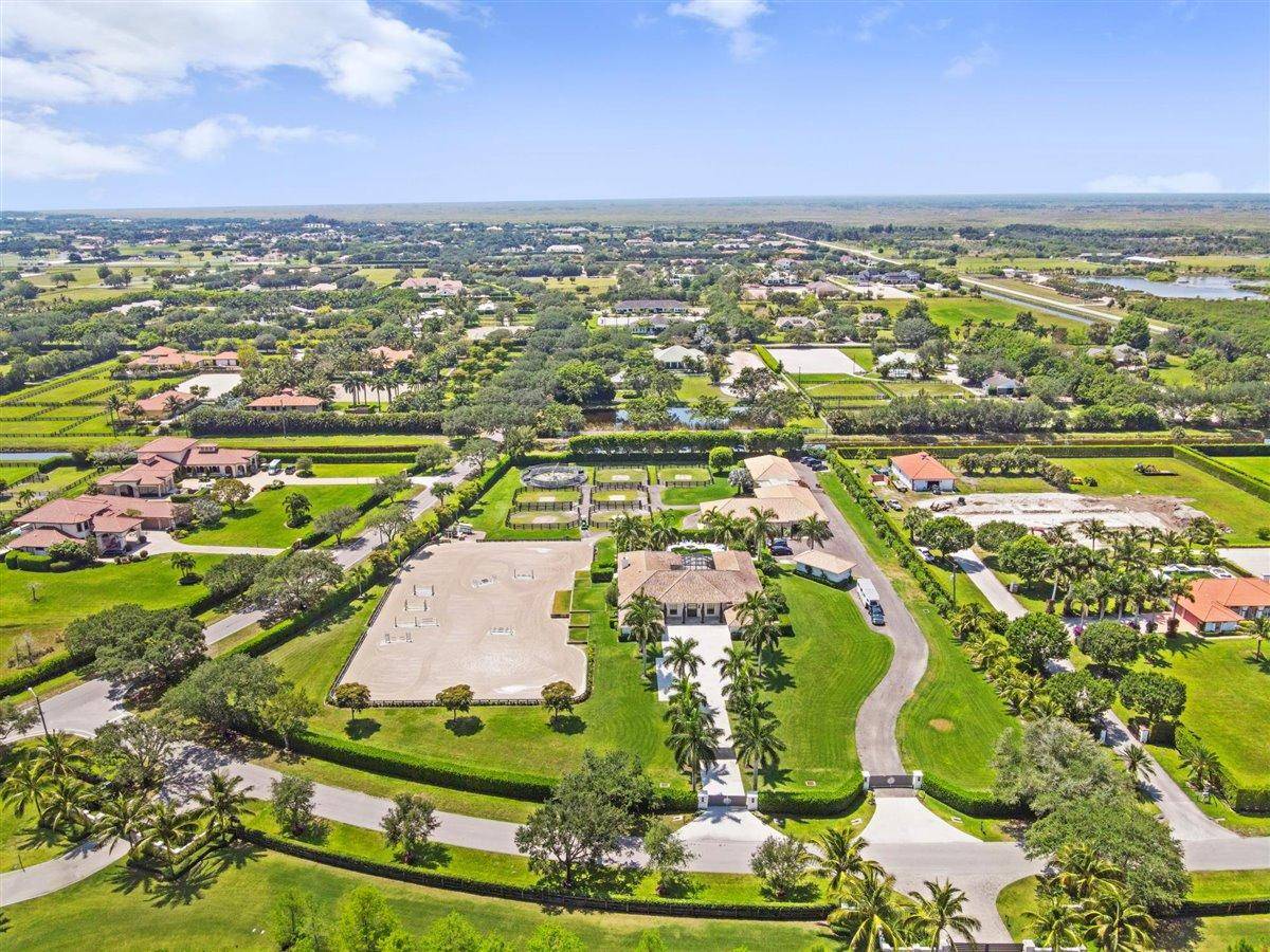 Striking 5. 7 acre equestrian estate in sought after Palm Beach Point only minutes to all horse show venues.