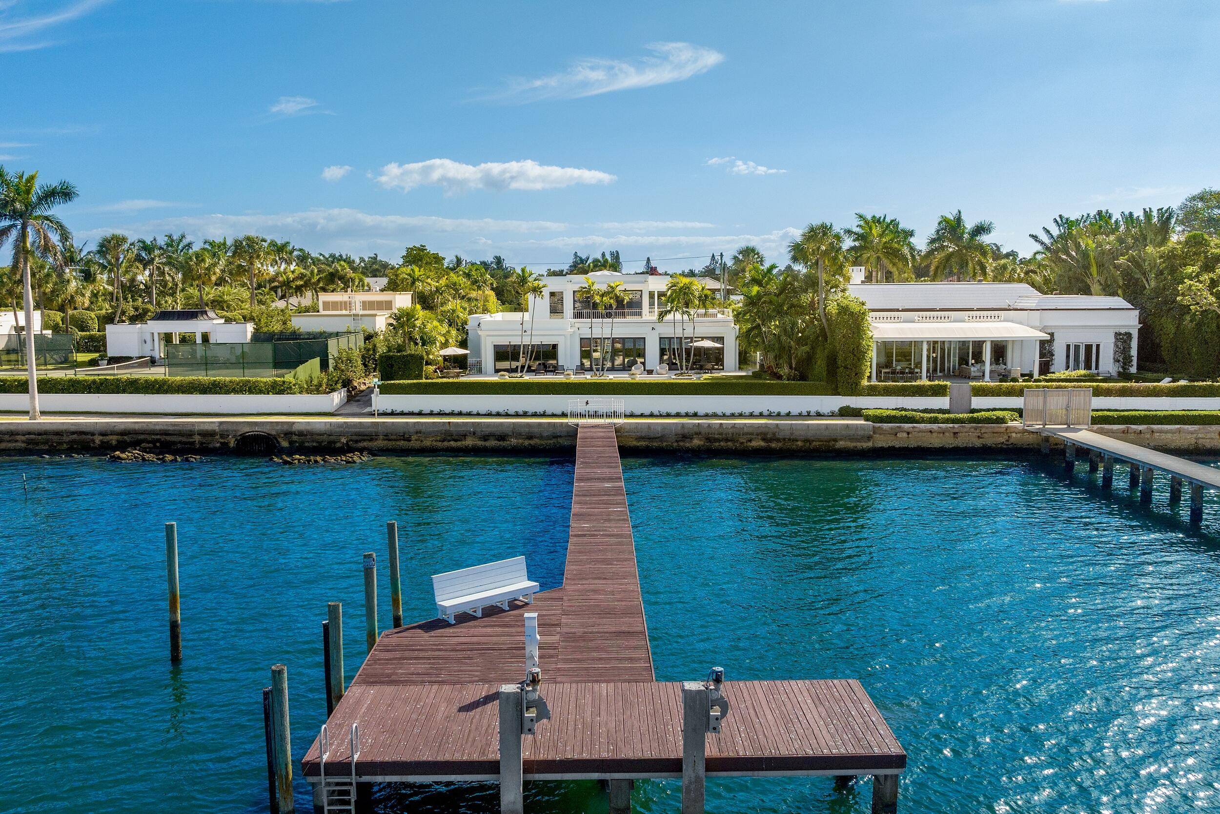 Stunning, contemporary regency with dramatic views of the Intracoastal waterway and the motor yachts at Rybovich Marina.