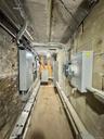 Unfinished basement featuring electric panel