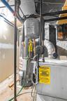 Mechanical room featuring a water heater, expansion tank, and furnace