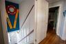 Stairs featuring wood finished floors and baseboards