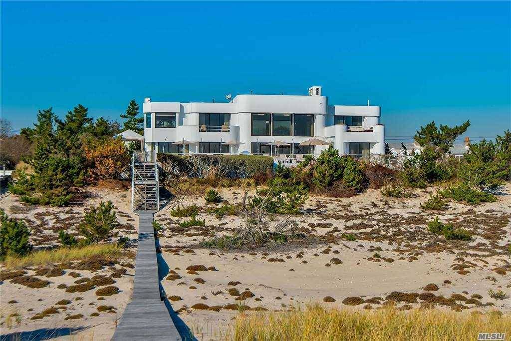 This stately contemporary, on 150 feet of oceanfront, exudes a subdued elegance amp ; offers a quiet respite from the world.