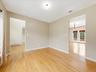 LIVING ROOM W/ VIEW OF DEN