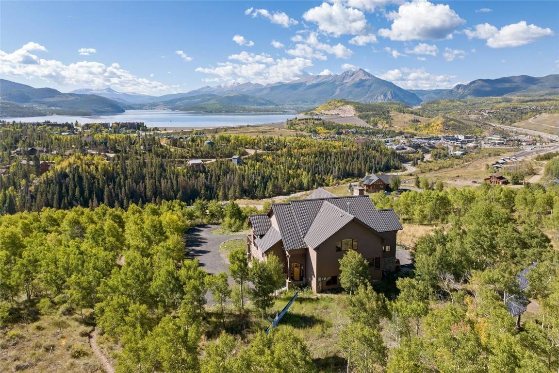 Welcome to the King of the Hill an iconic Silverthorne residence offering jaw dropping panoramic views of Lake Dillon, the Ten Mile Range and the Gore Range.