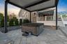 View of patio with a hot tub