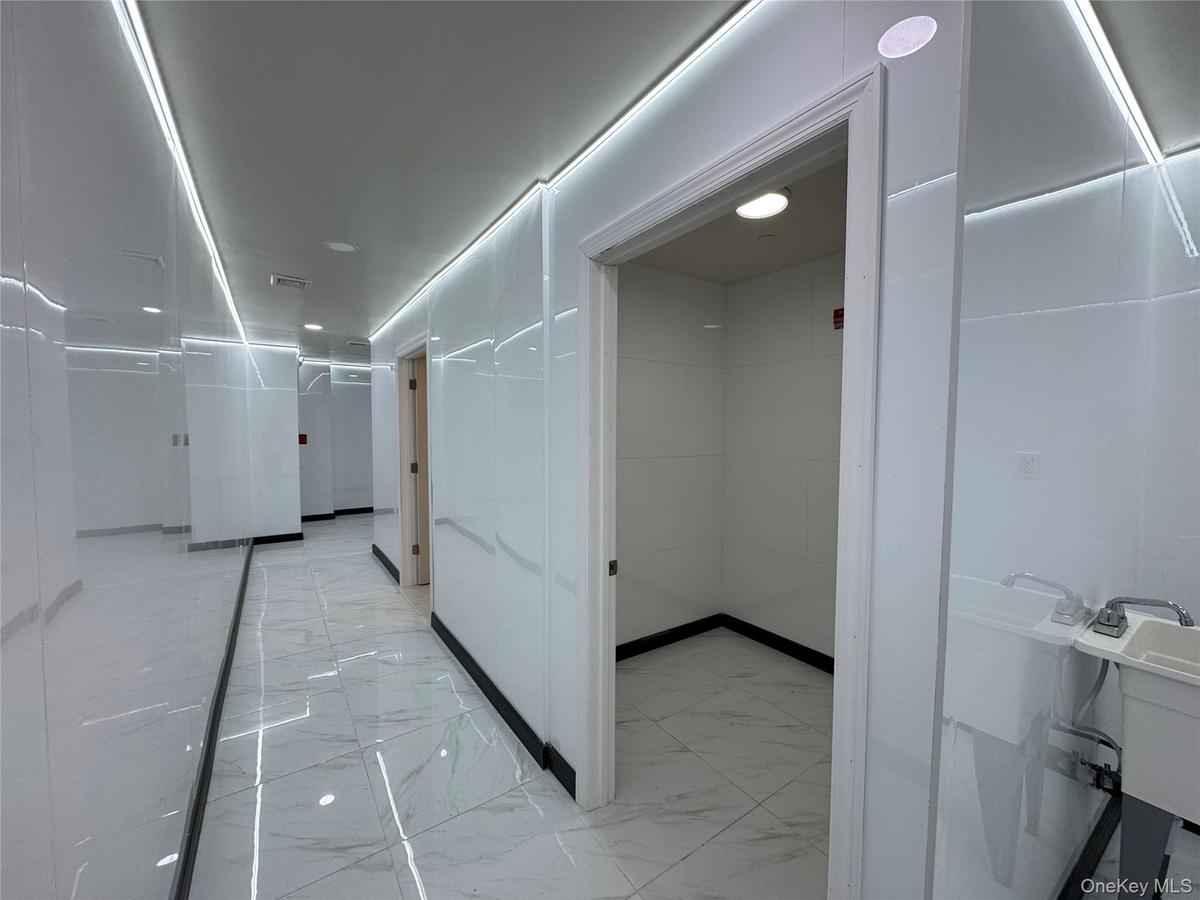Corridor with marble finish floor and visible vents