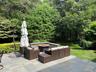 View of patio featuring an outdoor living space with a fire pit