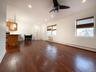 Unfurnished living room featuring a baseboard radiator, recessed lighting, dark wood finished floors, a ceiling fan, and a wall mounted air conditione