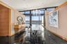 Dining area with expansive windows, plenty of natural light, and a water view