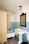 Bathroom featuring shower / bath combo with shower curtain, wood ceiling, and tile patterned flooring