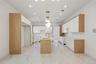 Kitchen featuring white cabinetry, a center island with sink, hanging light fixtures, modern cabinets, and recessed lighting